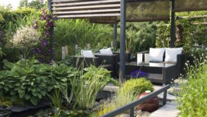 Modern patio garden lounge with a pond and outdoor sofas | Massachusetts Association of Buyer Agents | homebuyer real estate buyers broker