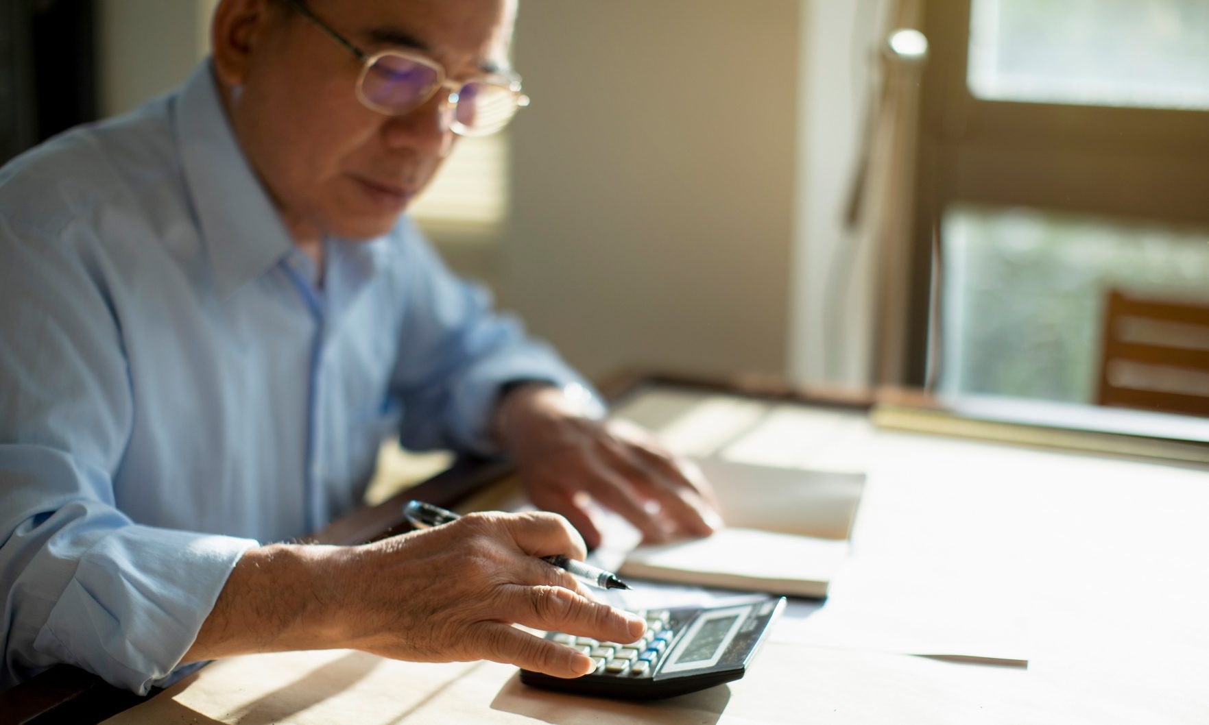 man at calculator