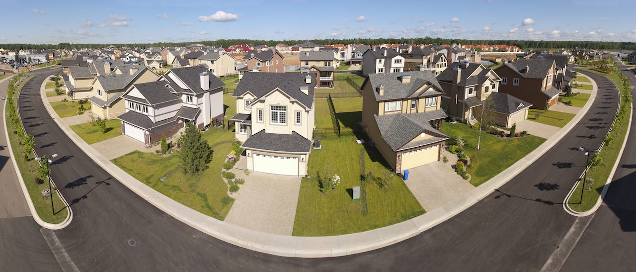 High angle view of suburban houses along a curving street