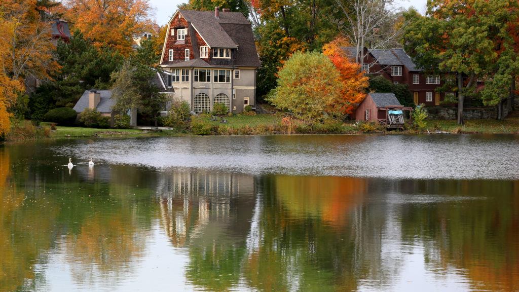 Home in melrose by pond in fall