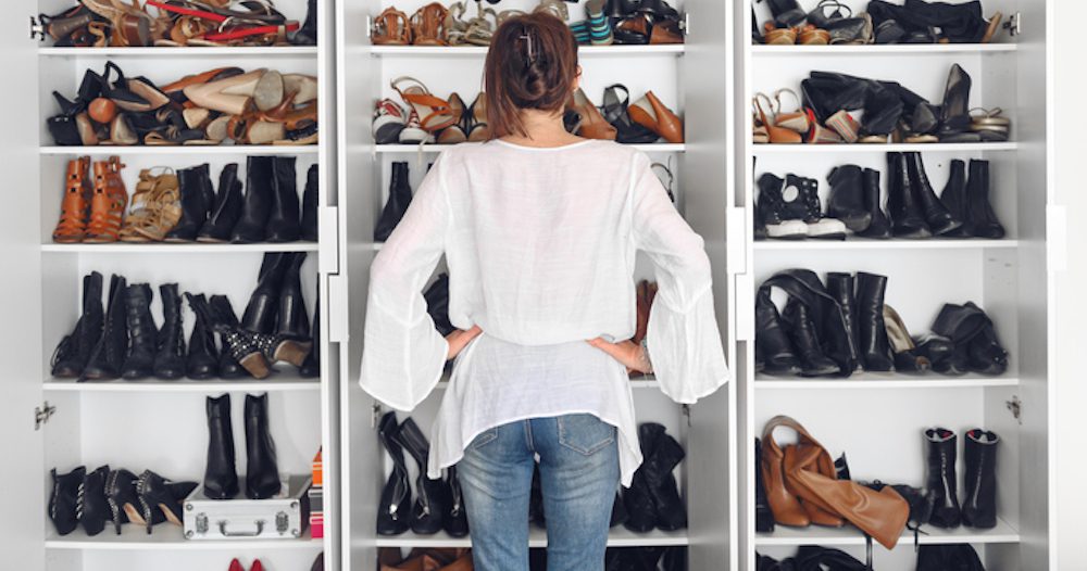 Woman cleaning shoes closet